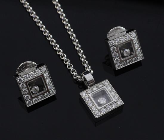 A modern 18ct white gold and diamond suite of jewellery by Chopard, pendant 0.5in inc. bale.